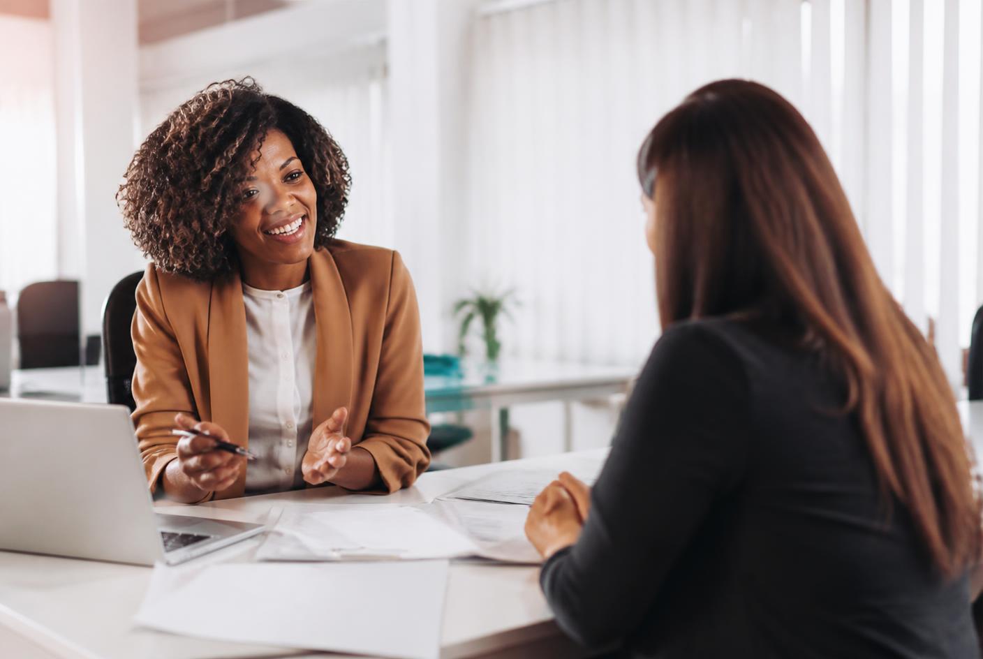 Insurance professional speaking with a consumer about health coverage options
